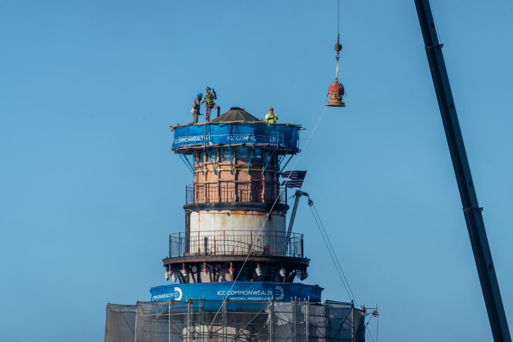 Large vent ball removed from lighthouse with crane